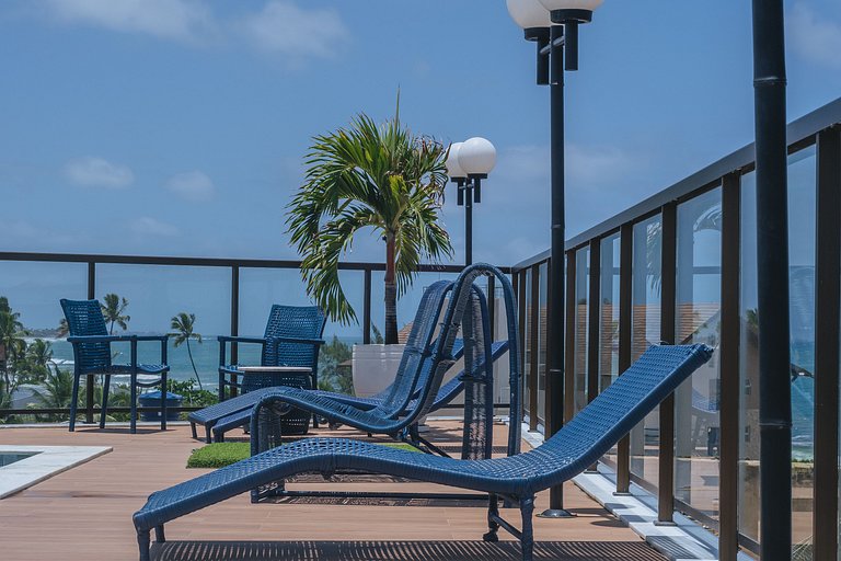 Flat elegante com rooftop e piscina vista mar
