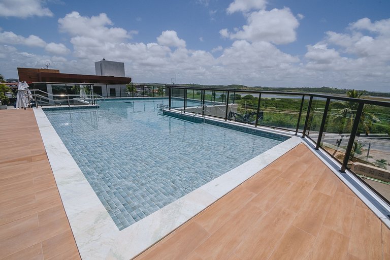 Flat elegante com rooftop e piscina vista mar