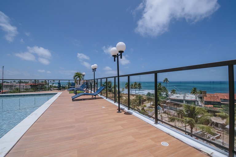 Flat elegante com rooftop e piscina vista mar