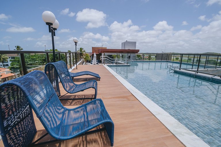 Flat elegante com rooftop e piscina vista mar