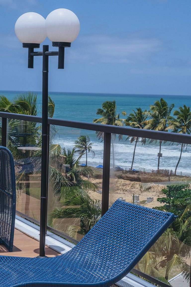 Flat elegante com rooftop e piscina vista mar