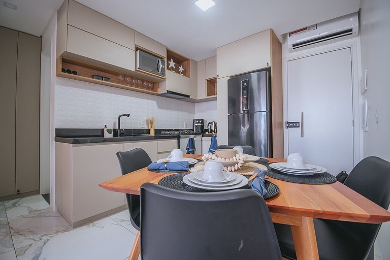 Flat elegante com rooftop e piscina vista mar