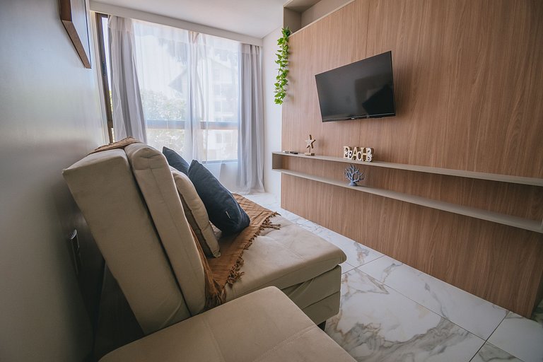 Flat elegante com rooftop e piscina vista mar
