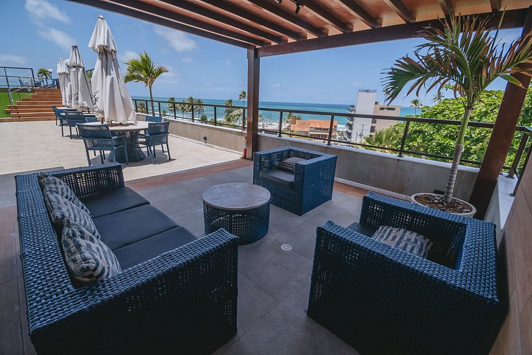 Flat elegante com rooftop e piscina vista mar
